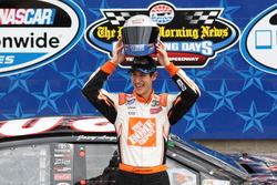 Joey Logano celebrates winning the pole for the 2010 NASCAR Nationwide Series O'Reilly Auto Parts 300 at Texas Motor Speedway. Photo by George Walker.